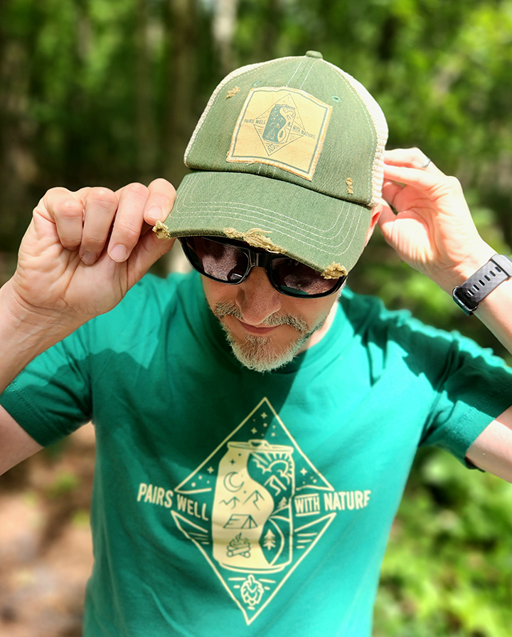 Vintage Distressed Trucker Cap - "Pairs Well with Nature" These distressed beer hats are incredibly comfortable. Most trucker caps are rigid, but these vintage unstructured caps are made of a cotton/polyester blend with a soft mesh back that makes them fit more like a "Dad Hat." Now in Canada.