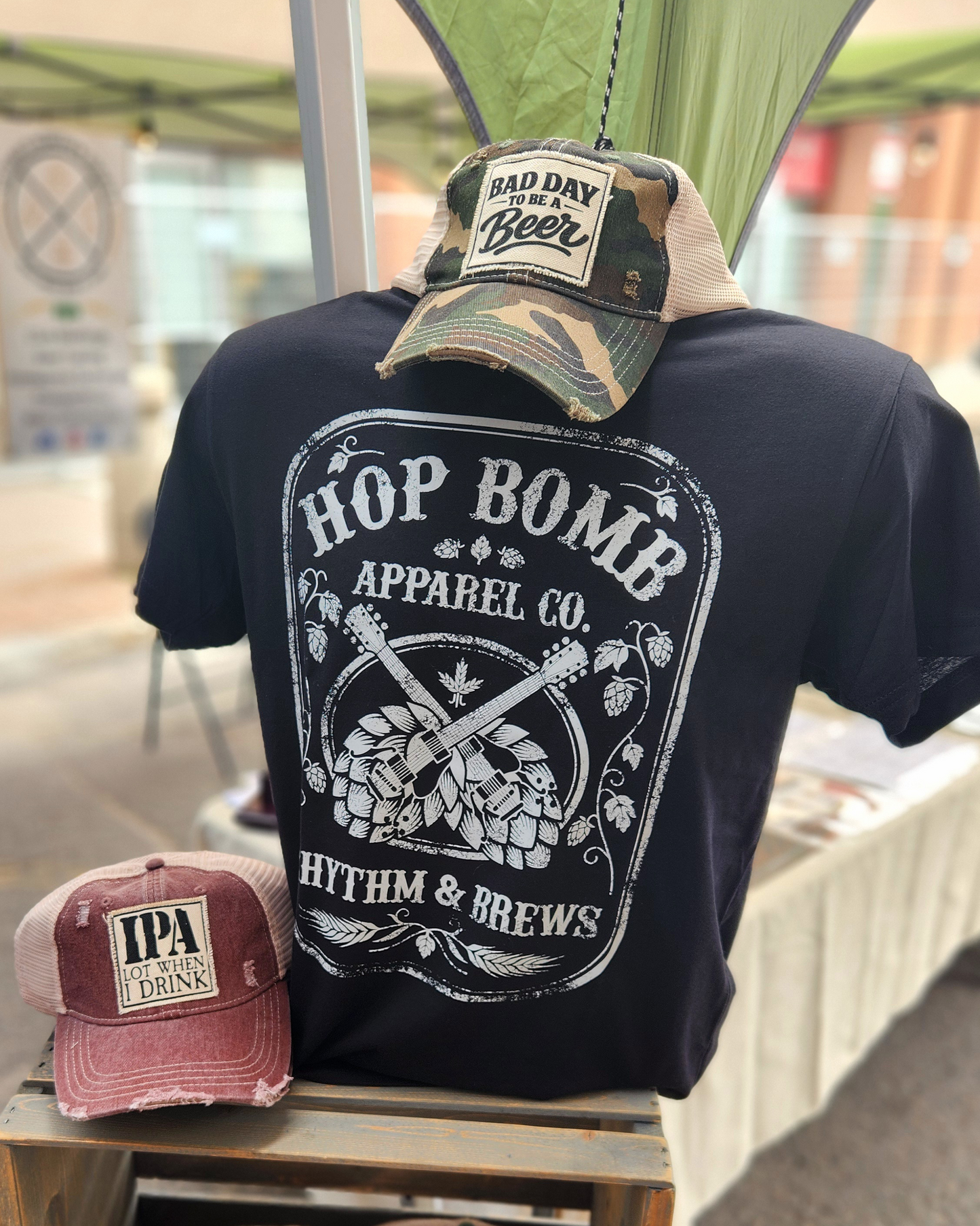 Rhythm & Brews graphic tee displayed at a beer festival, perfect for craft beer lovers, live music fans, and concert goers