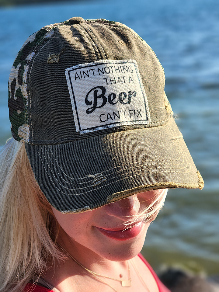 Vintage Distressed Trucker Cap - "Ain't Nothing That A Beer Can't Fix" These distressed beer hats are incredibly comfortable. Most trucker caps are rigid, but these vintage unstructured caps are made of a cotton/polyester blend with a soft mesh back that makes them fit more like a "Dad Hat." Now in Canada.