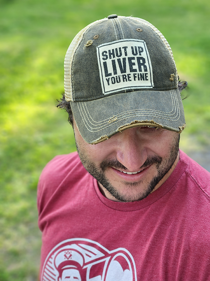 Vintage Distressed Trucker Cap - "Shut Up Liver You're Fine" These distressed beer hats are incredibly comfortable. Most trucker caps are rigid, but these vintage unstructured caps are made of a cotton/polyester blend with a soft mesh back that makes them fit more like a "Dad Hat." Now in Canada